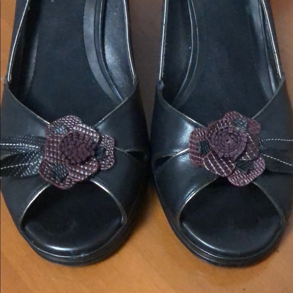 Black heels with cut out detail flowers.